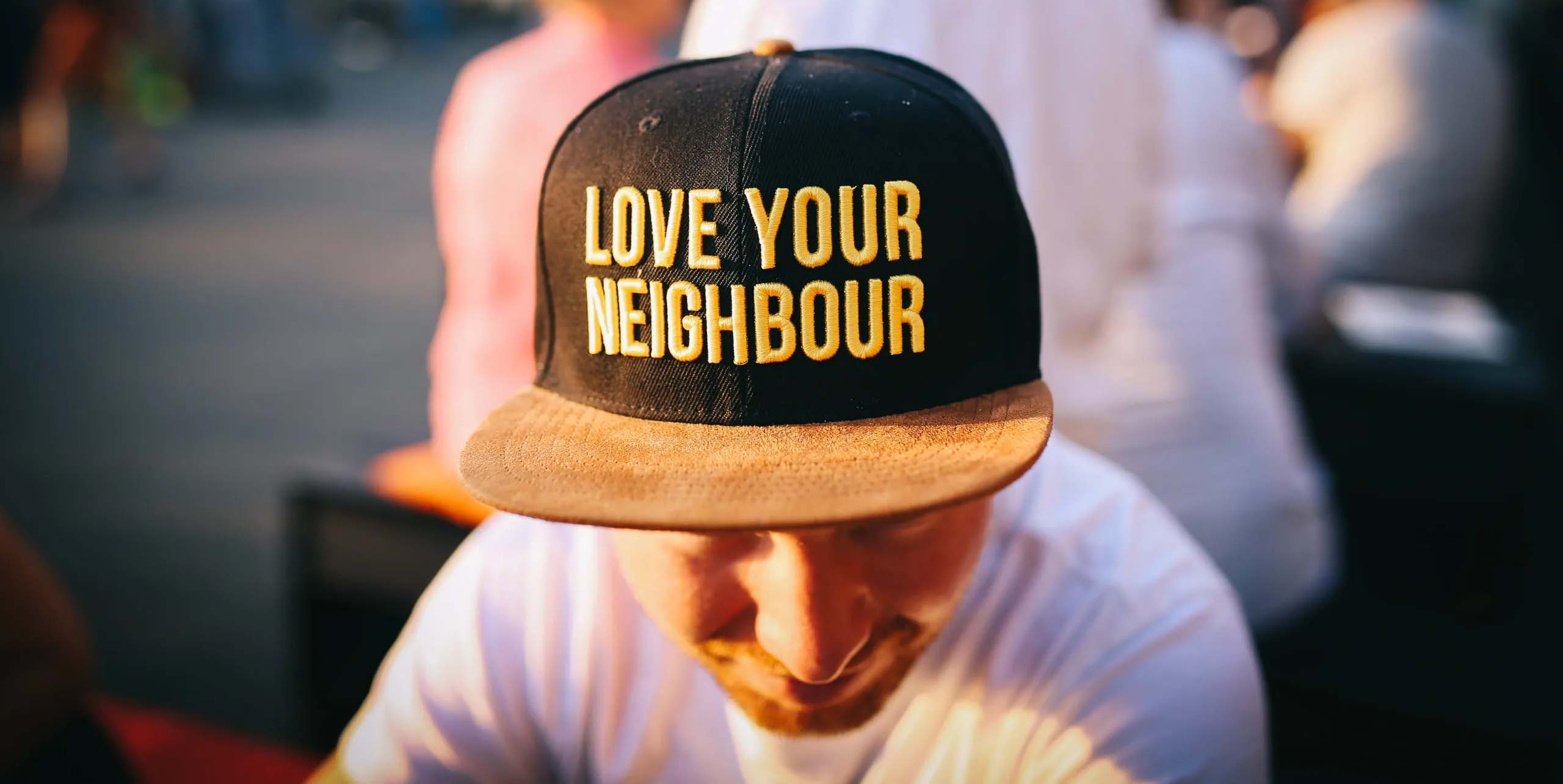 Love Your Neighbor hat logo